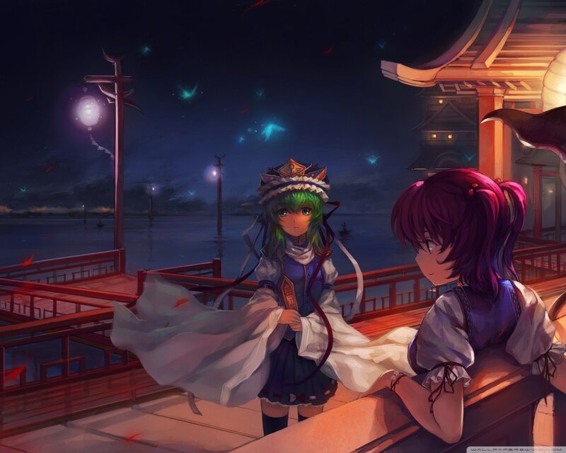 Two girls on a dock at night