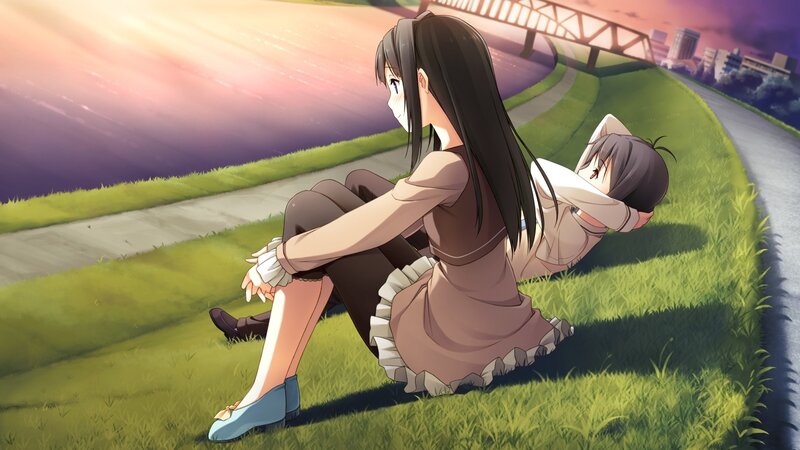 Two girls on a grassy hill