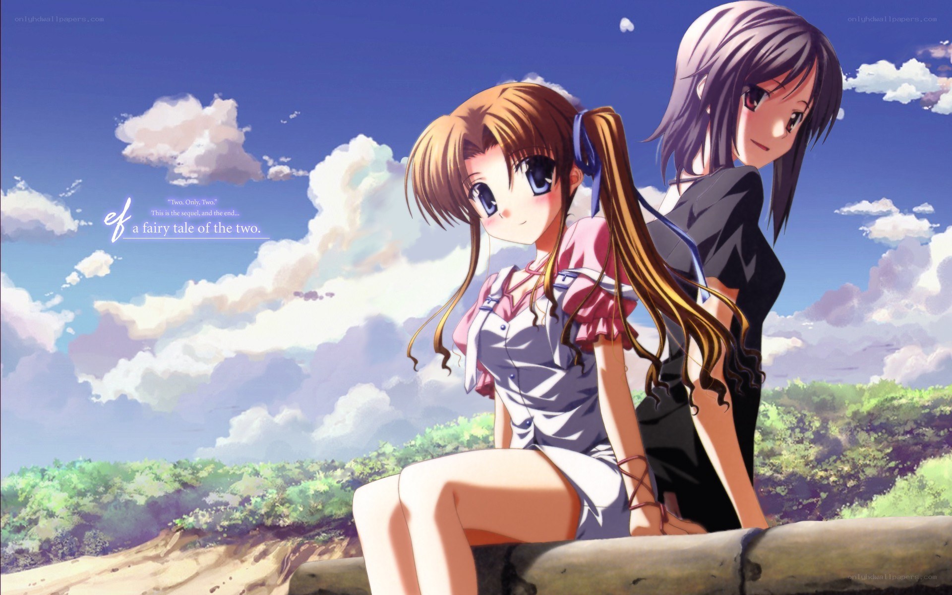 two girls on a hillside