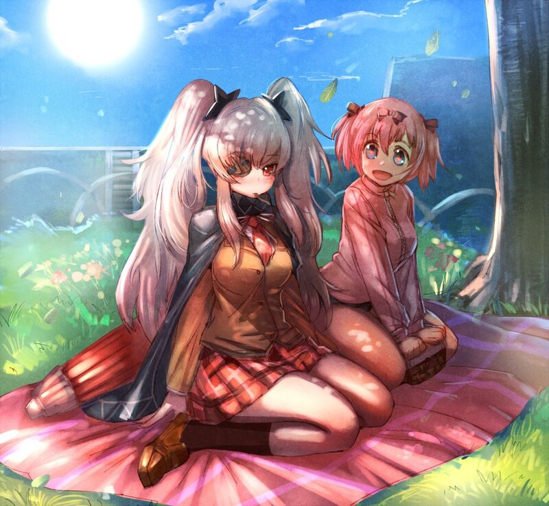 Two girls on a picnic blanket