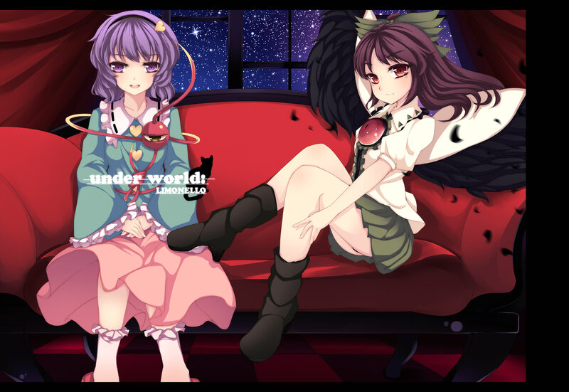 Two girls on a red couch