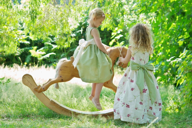 Two Girls on a Rocking Horse