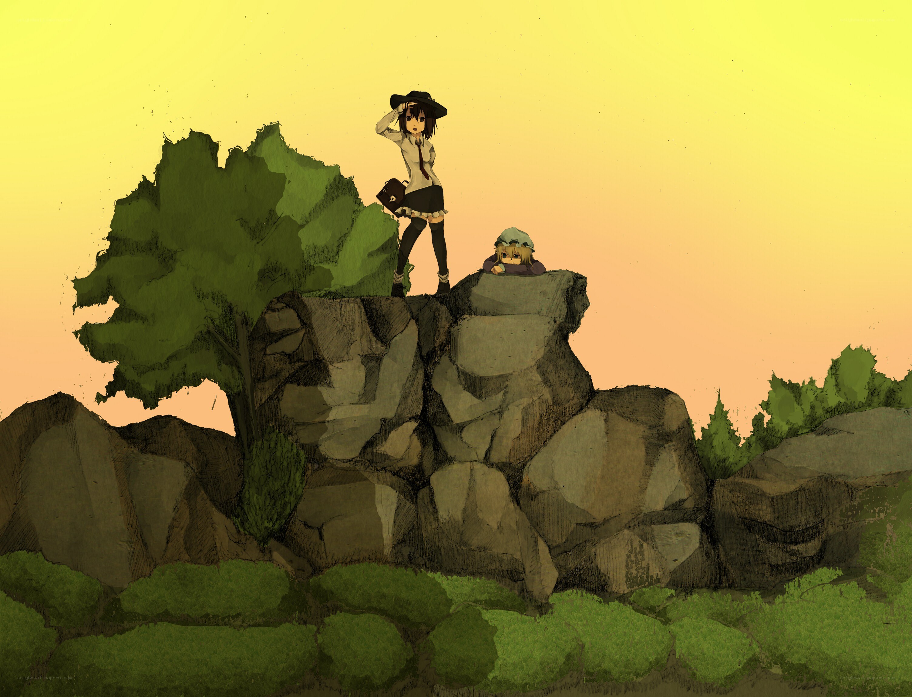 Two girls on a rocky cliff
