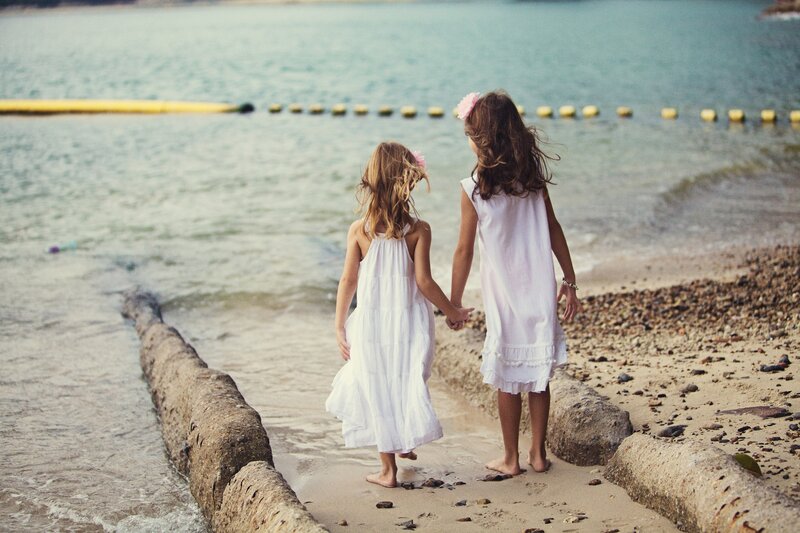 Two Girls on Beach — White, Serene, Afternoon