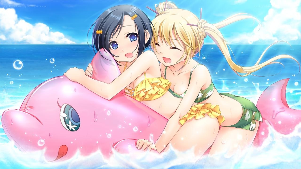 Two girls on inflatable dolphin