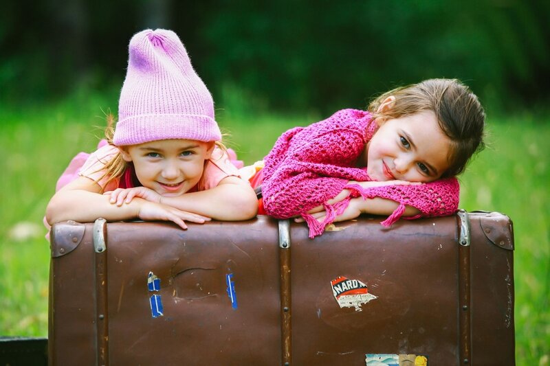 Two Girls on Suitcase