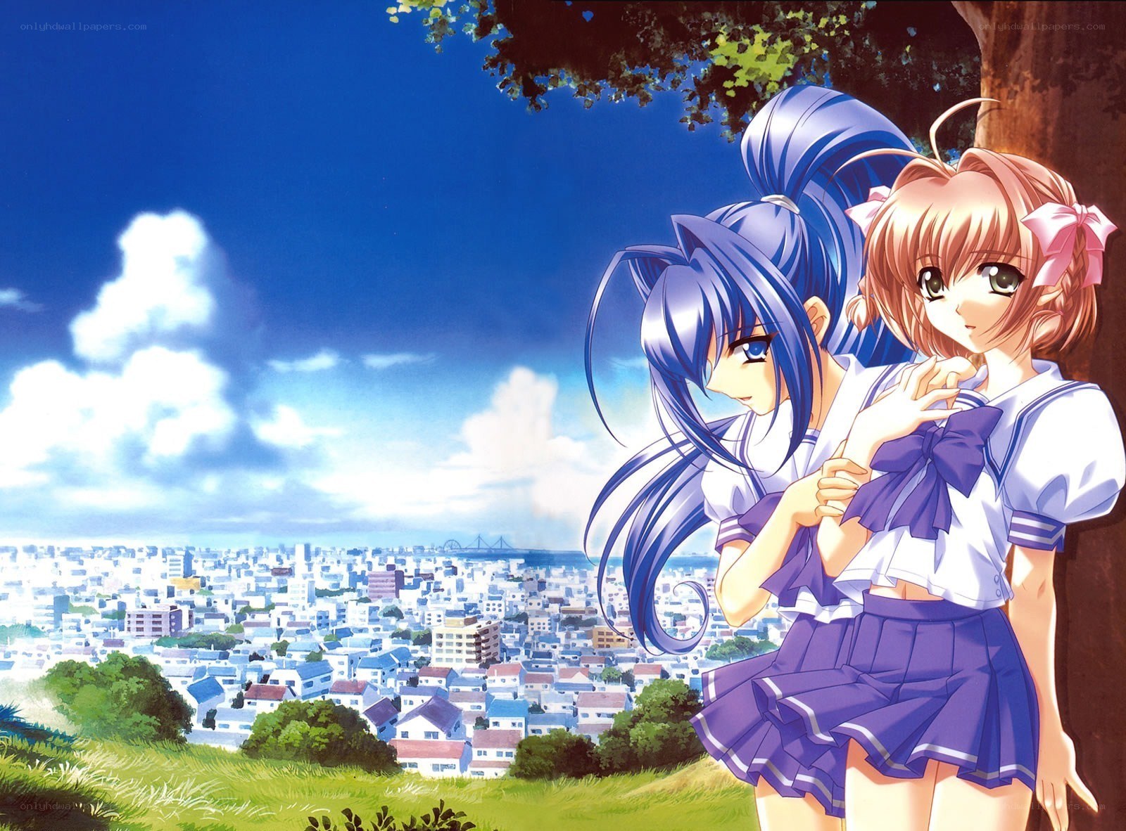 Two girls overlooking a city