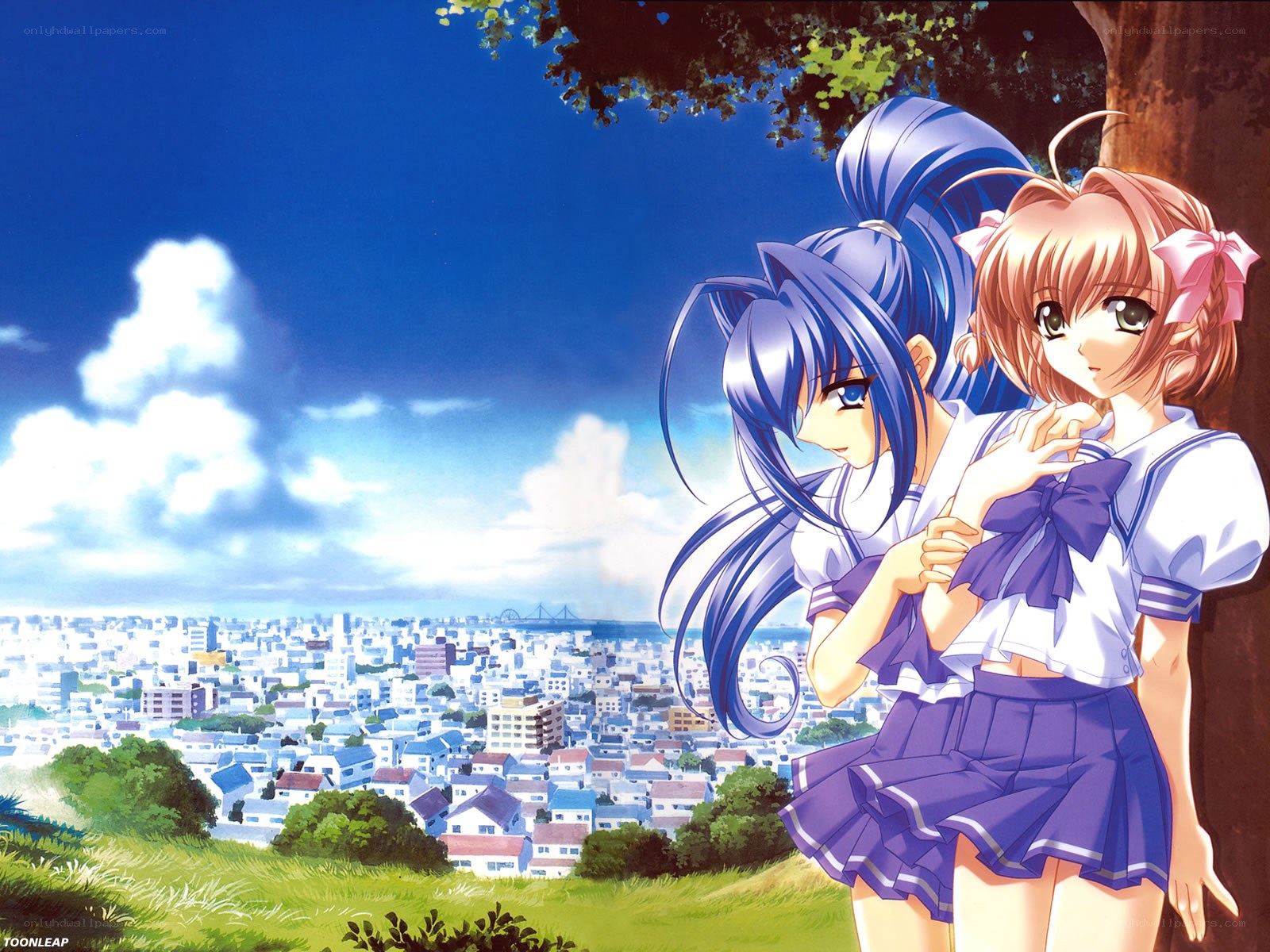 Two girls overlooking a city