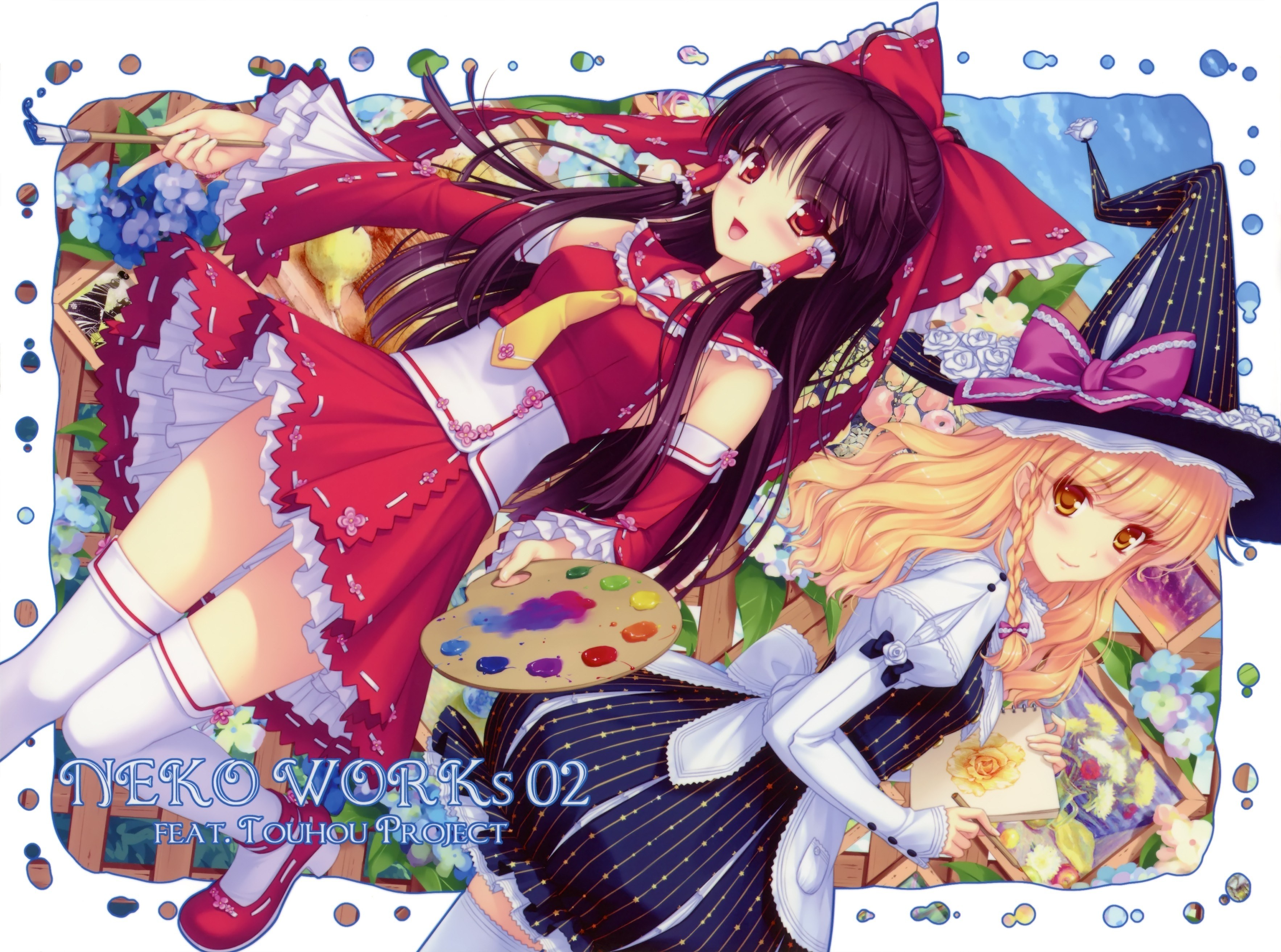 Two girls painting artwork