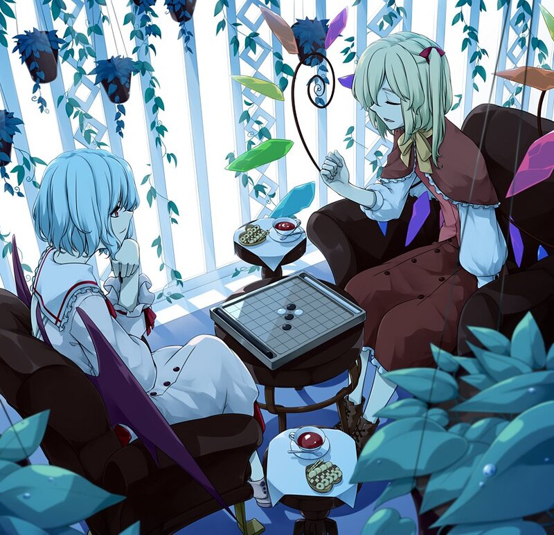 Two girls playing go in a garden