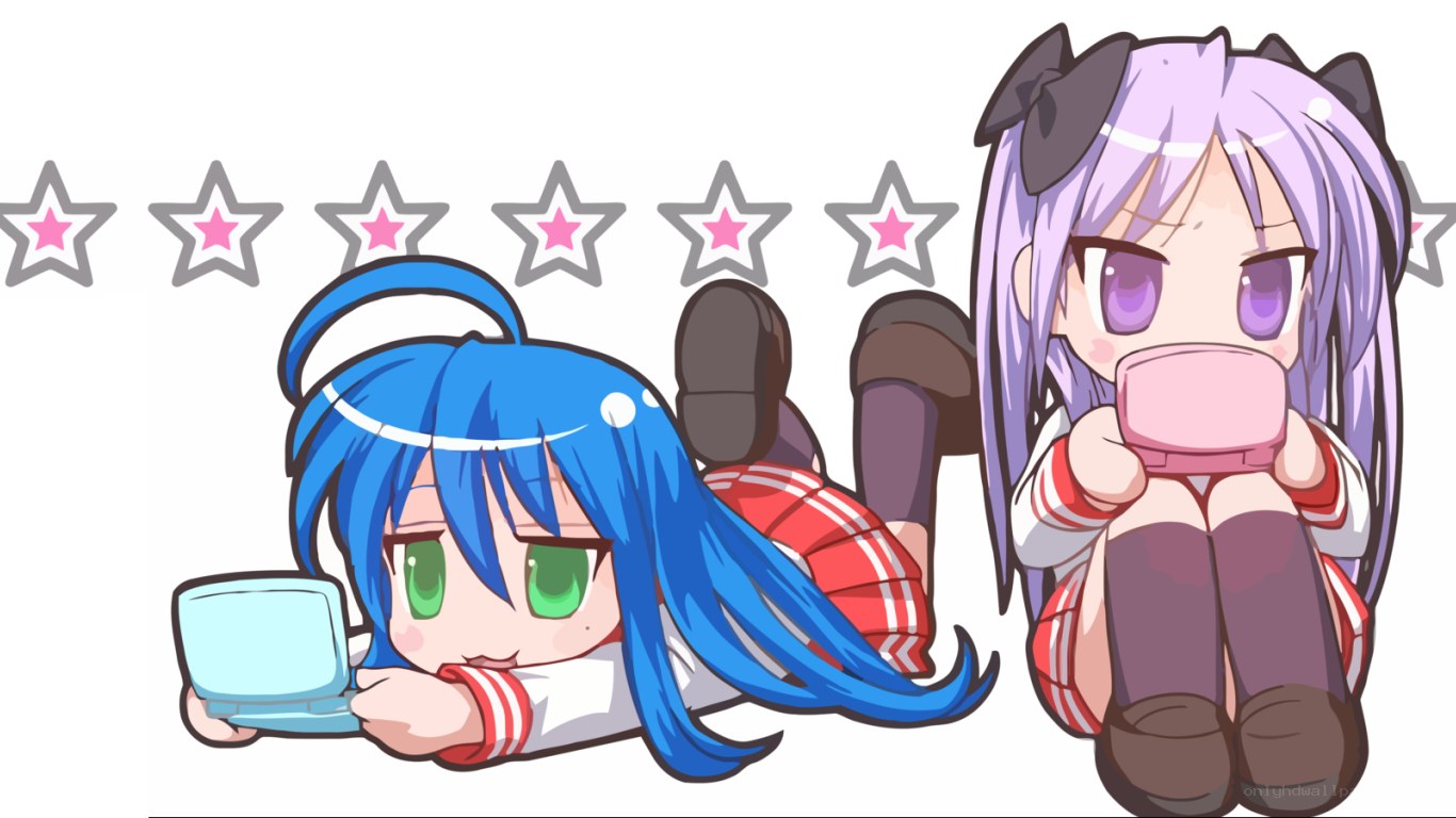 Two girls playing handheld games