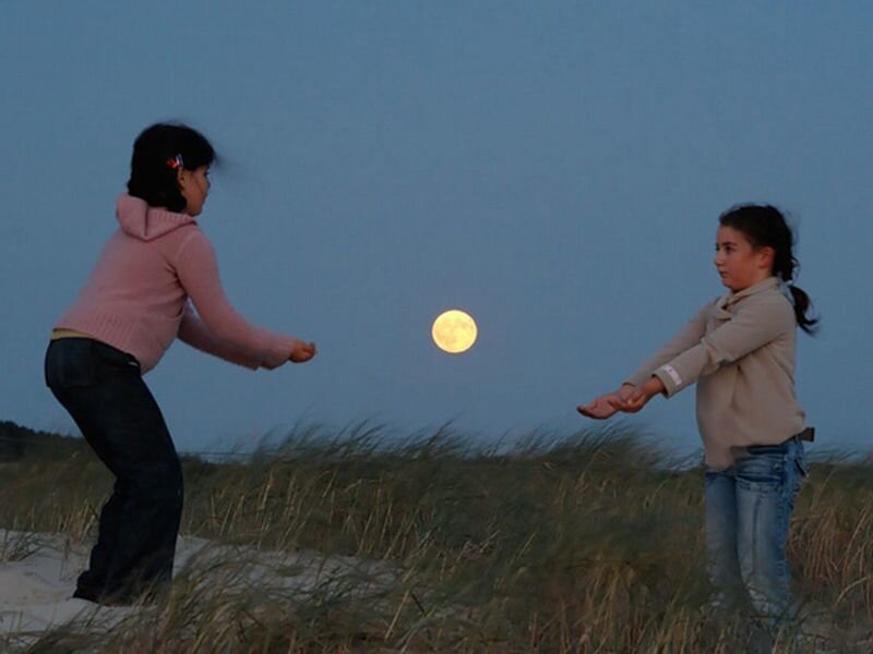 Two Girls Playing on Beach