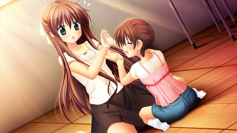Two girls playing on the floor