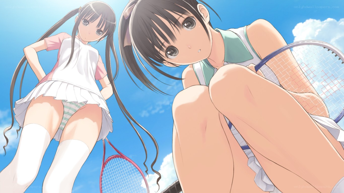 Two girls playing tennis