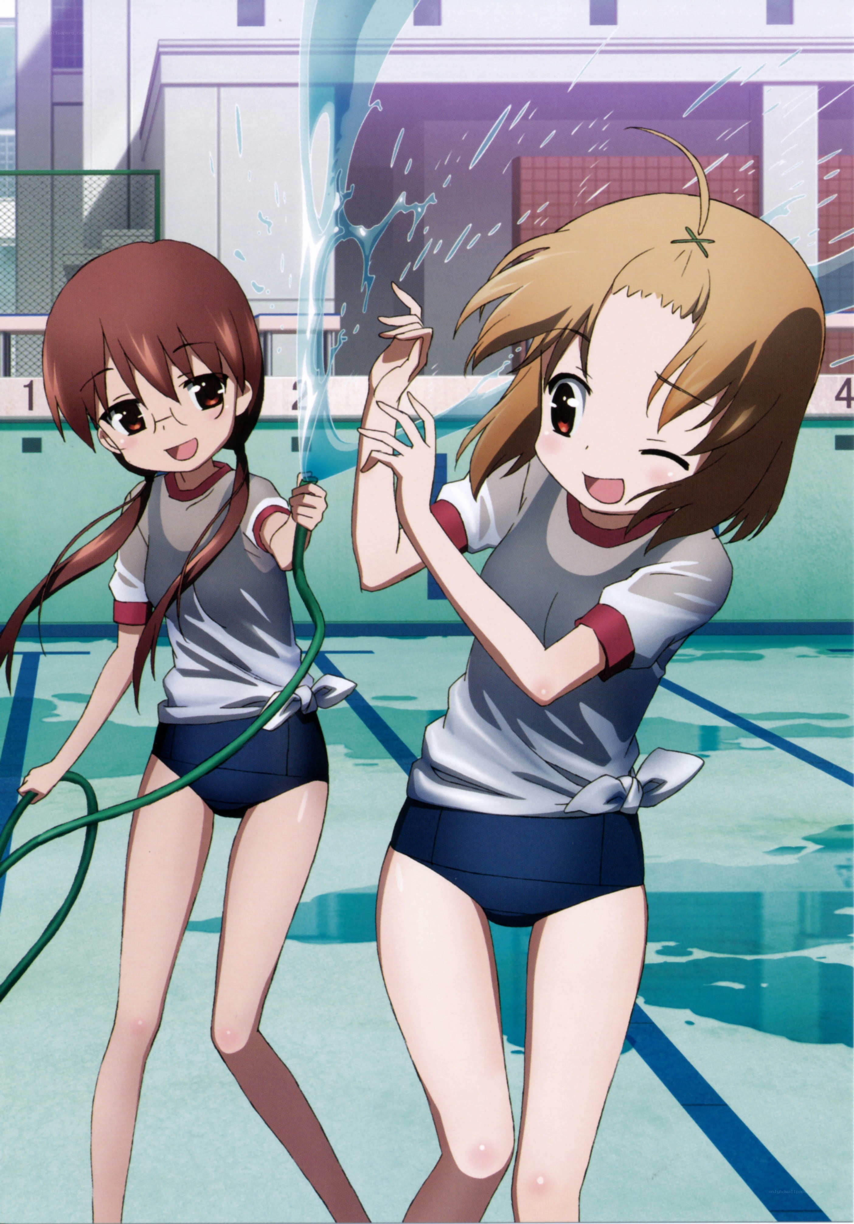 Two girls playing with a hose