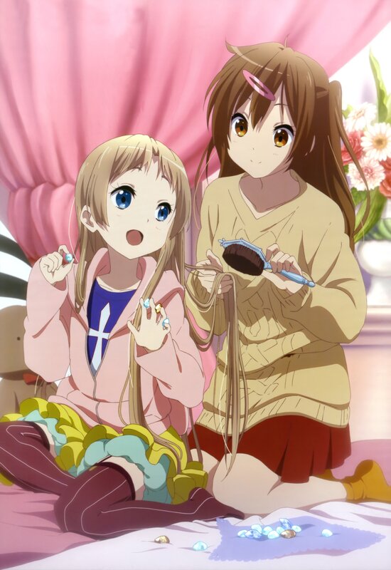 Two girls playing with hair accessories