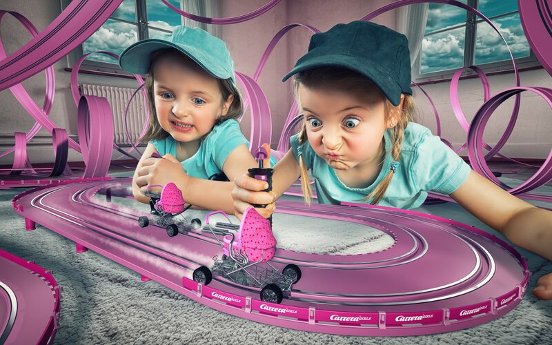 Two Girls Playing with Toy Cars