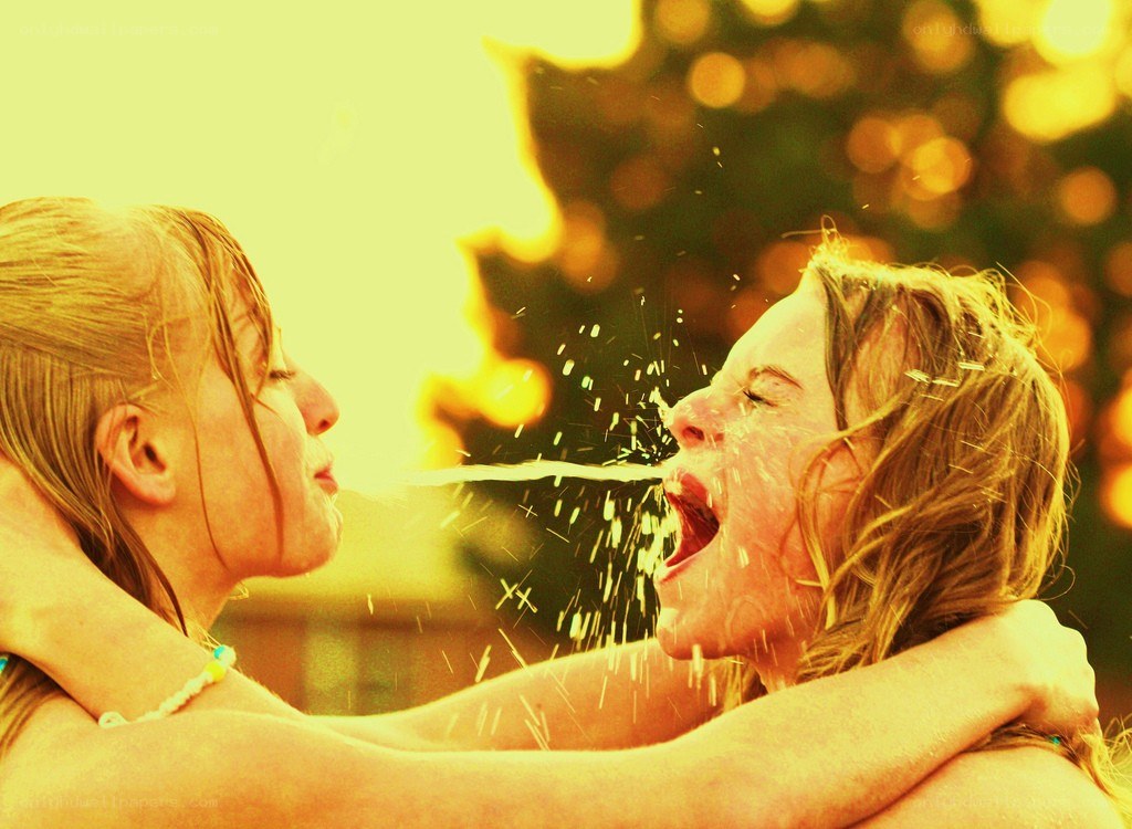 Two girls playing with water