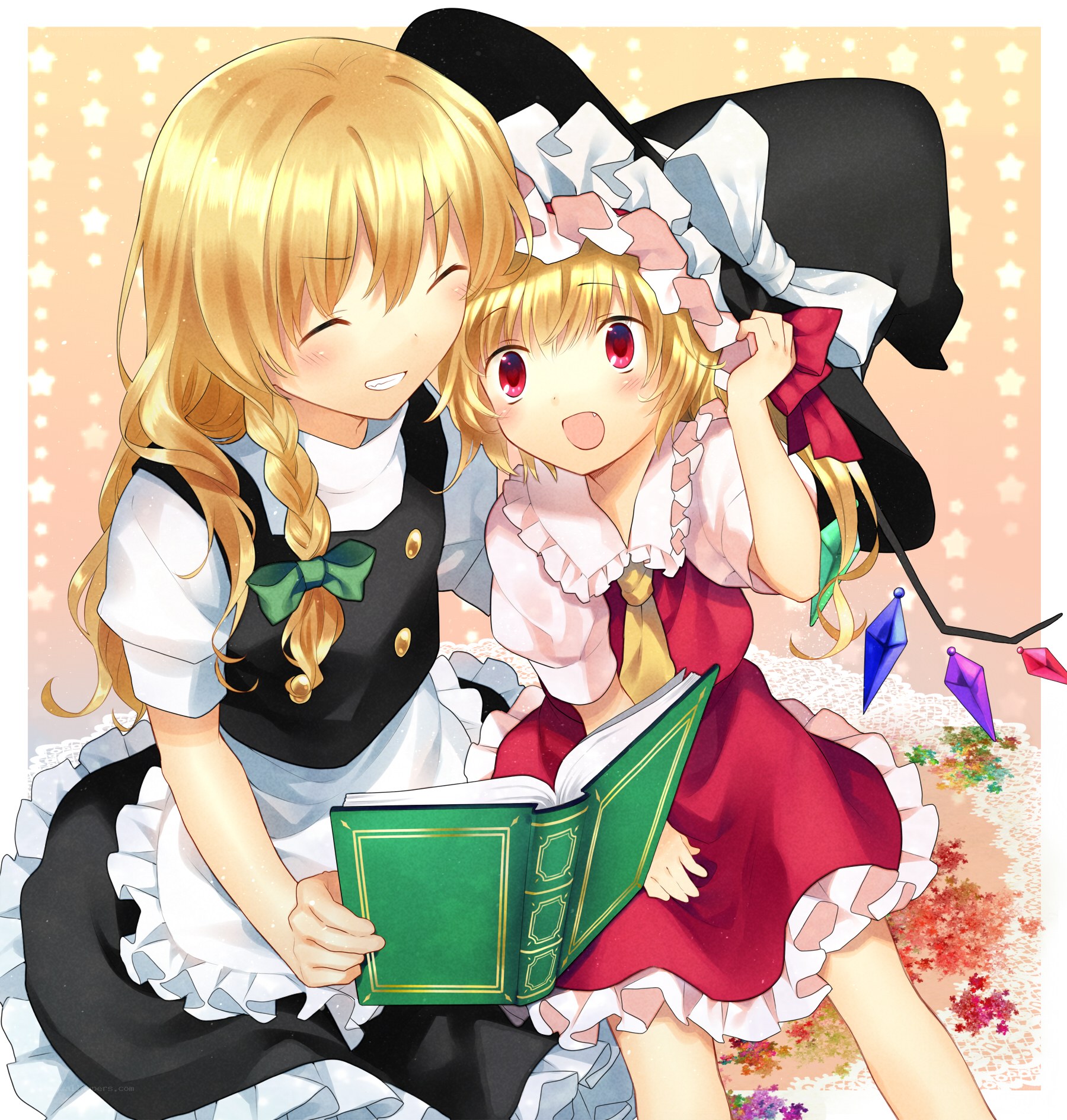 Two girls reading a book