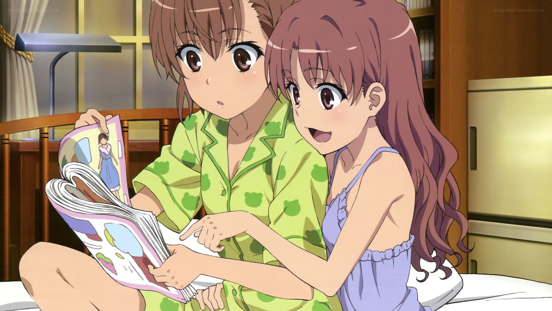 Two girls reading a magazine
