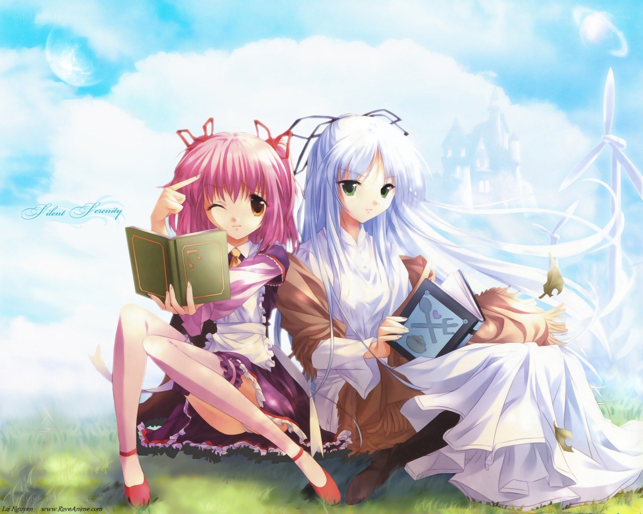 Two girls reading in a field