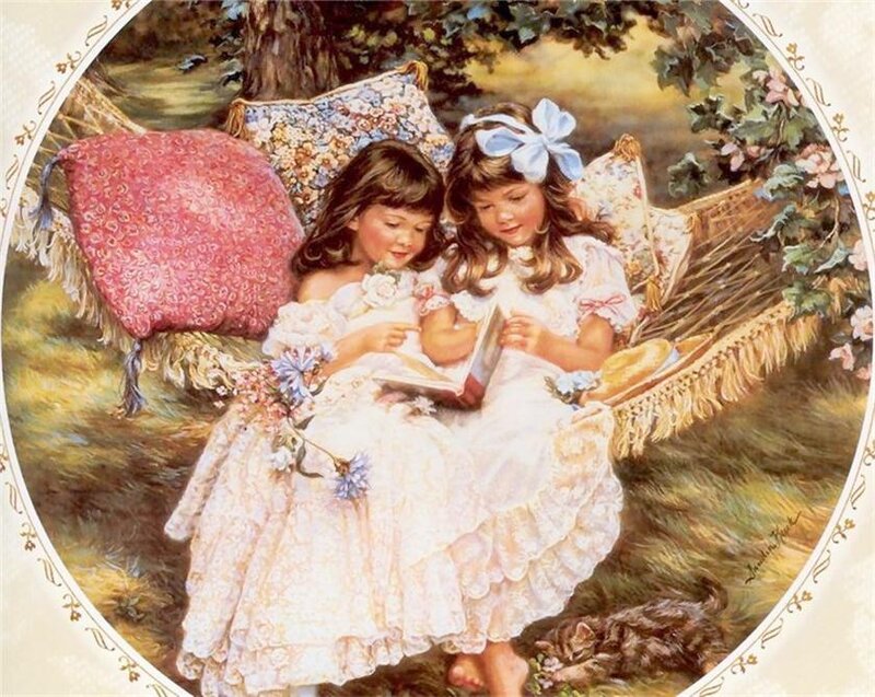 Two girls reading in a hammock