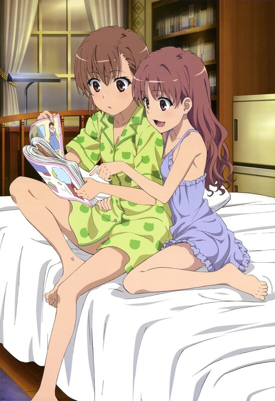 Two girls reading in bed
