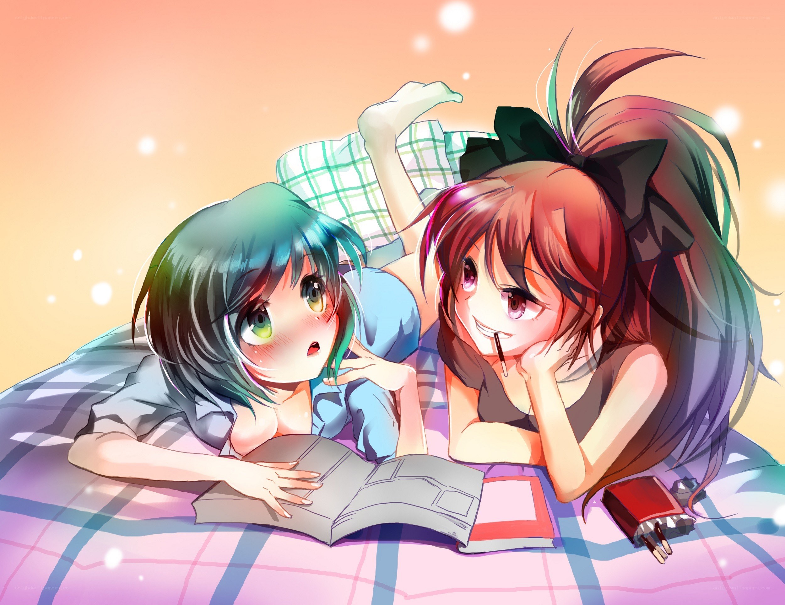 Two girls reading together