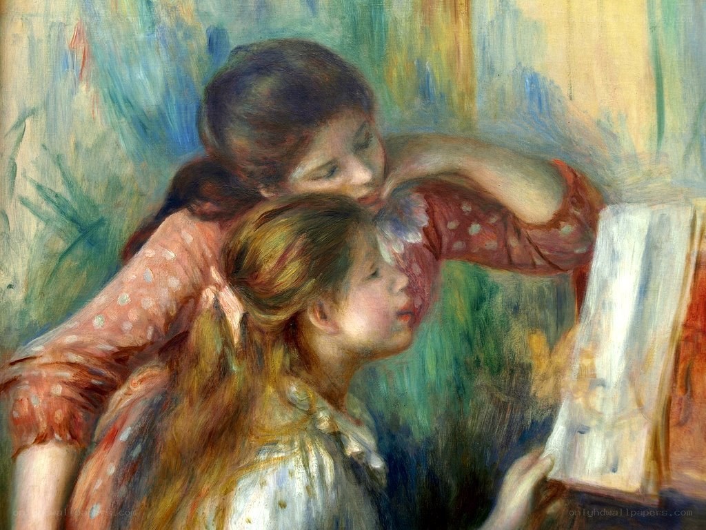 Two girls reading together