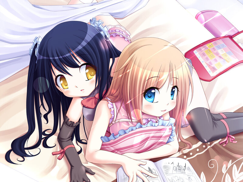 Two girls reading together
