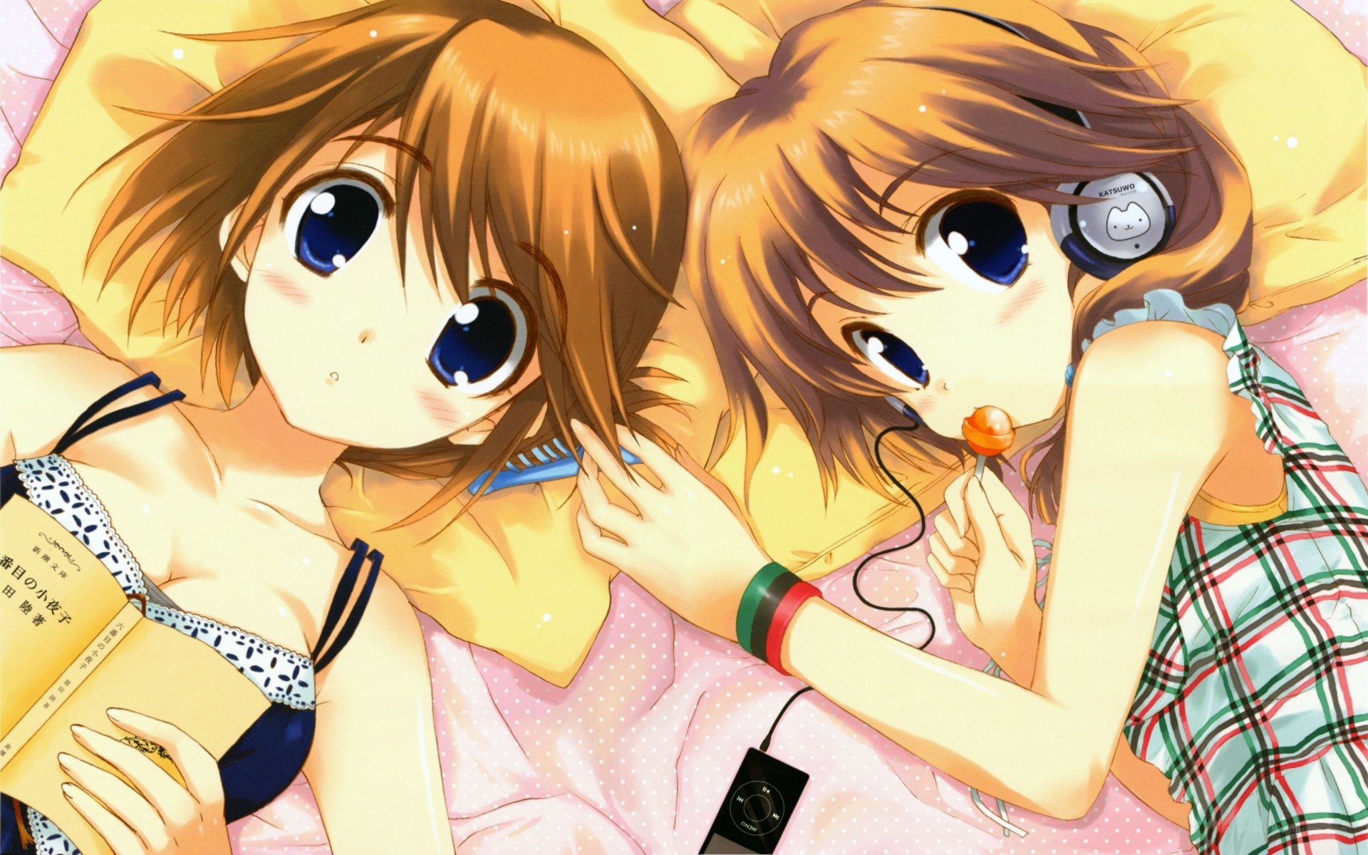 Two girls relaxing in bed