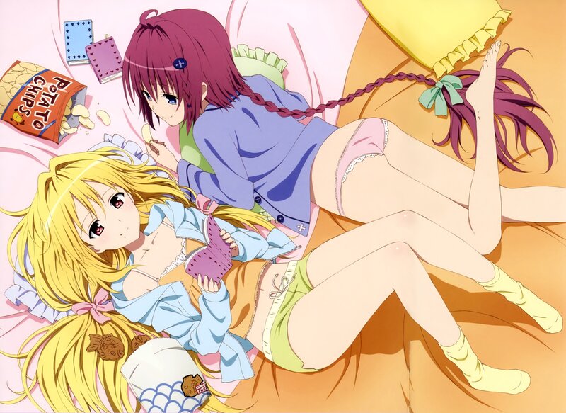Two girls relaxing on a bed