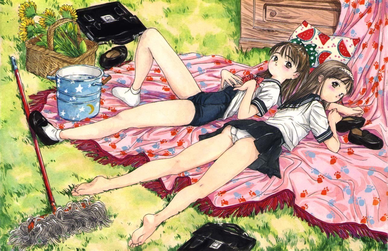 Two girls relaxing on a blanket