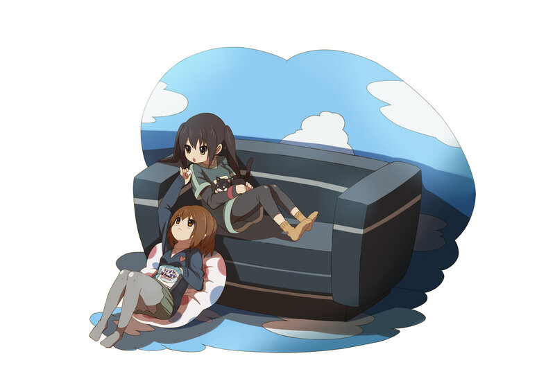 Two girls relaxing on a couch