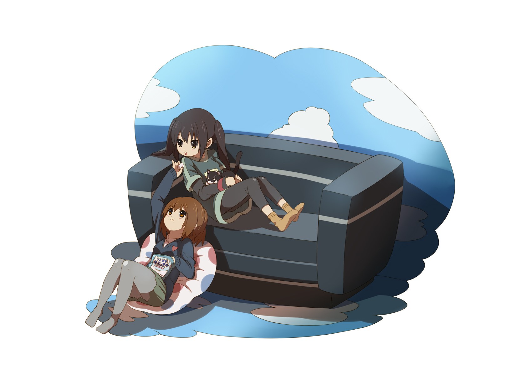Two girls relaxing on a couch
