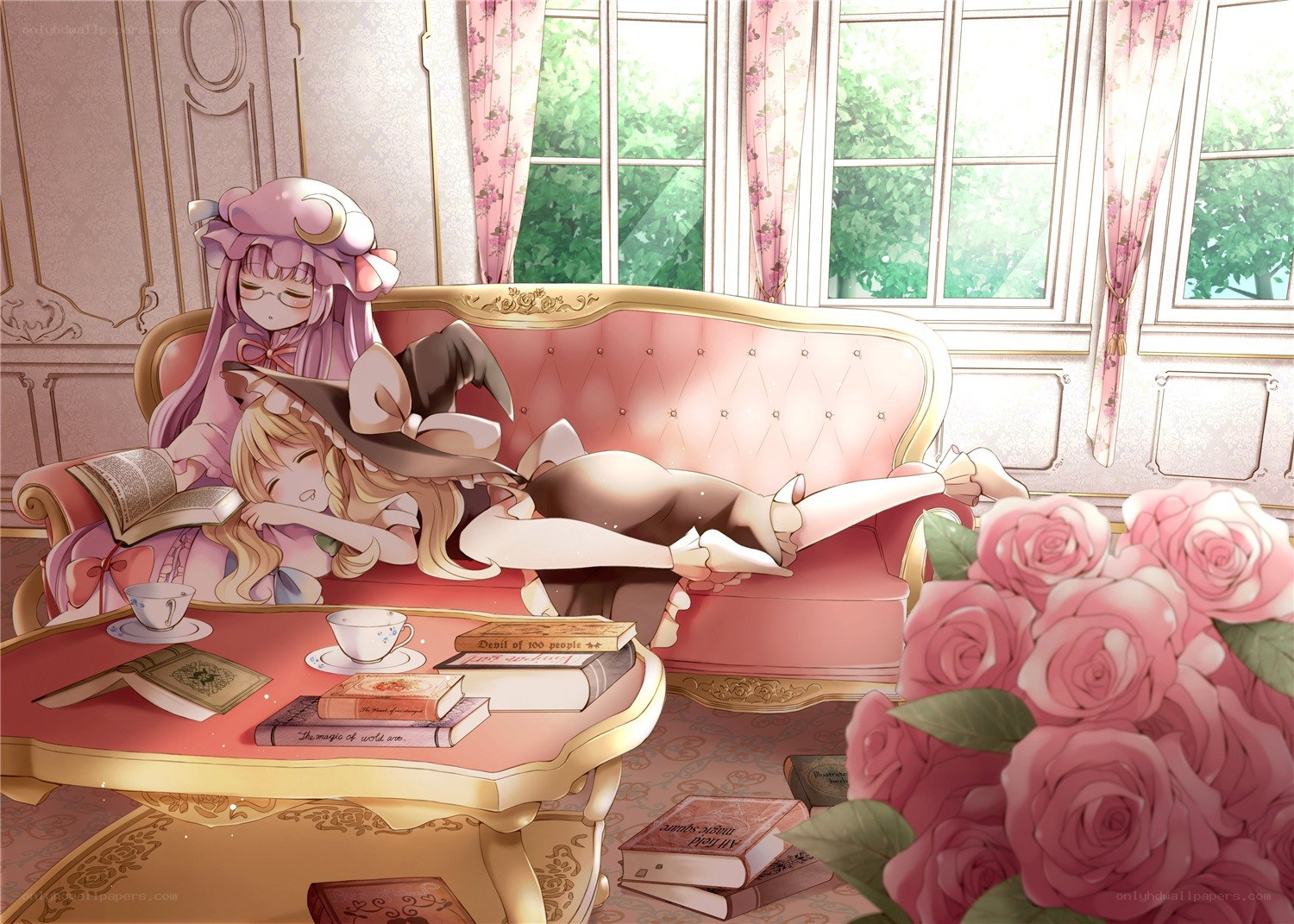Two girls relaxing on a sofa