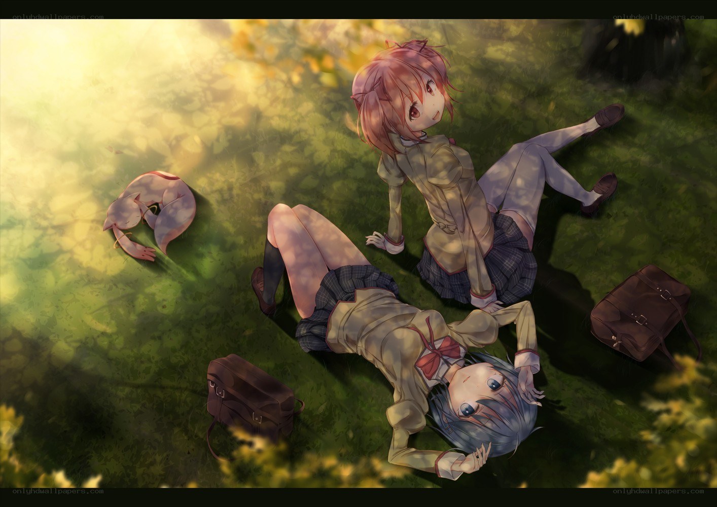 Two girls relaxing on grass