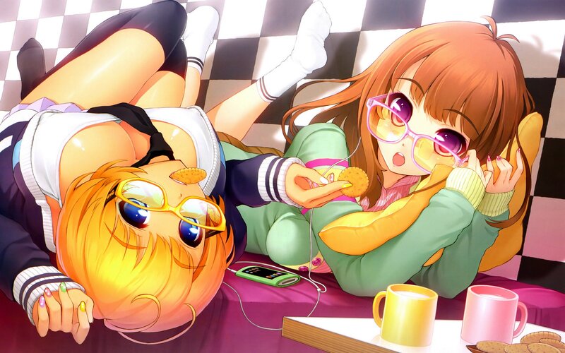 Two girls relaxing with snacks