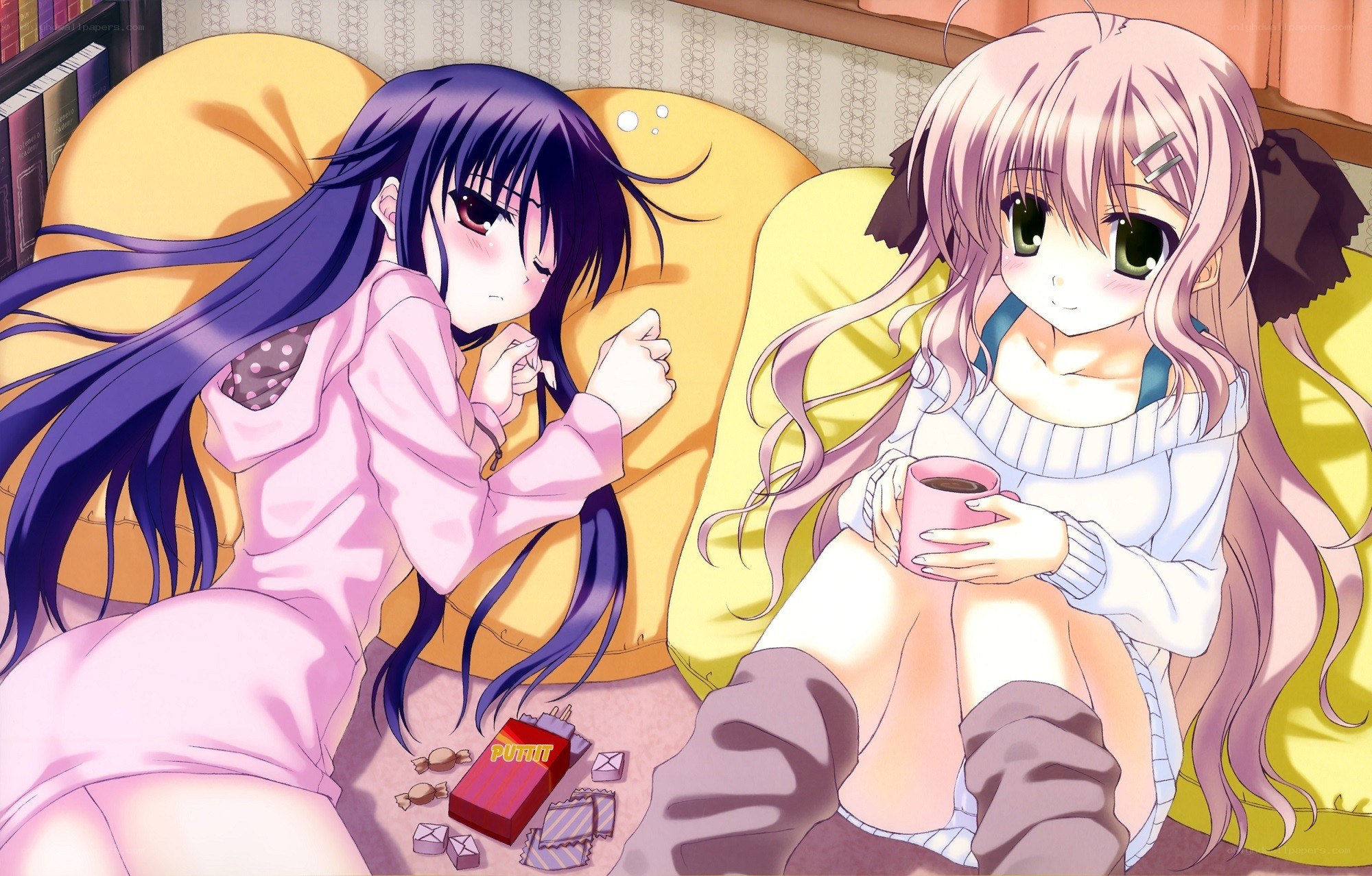 Two girls relaxing with snacks