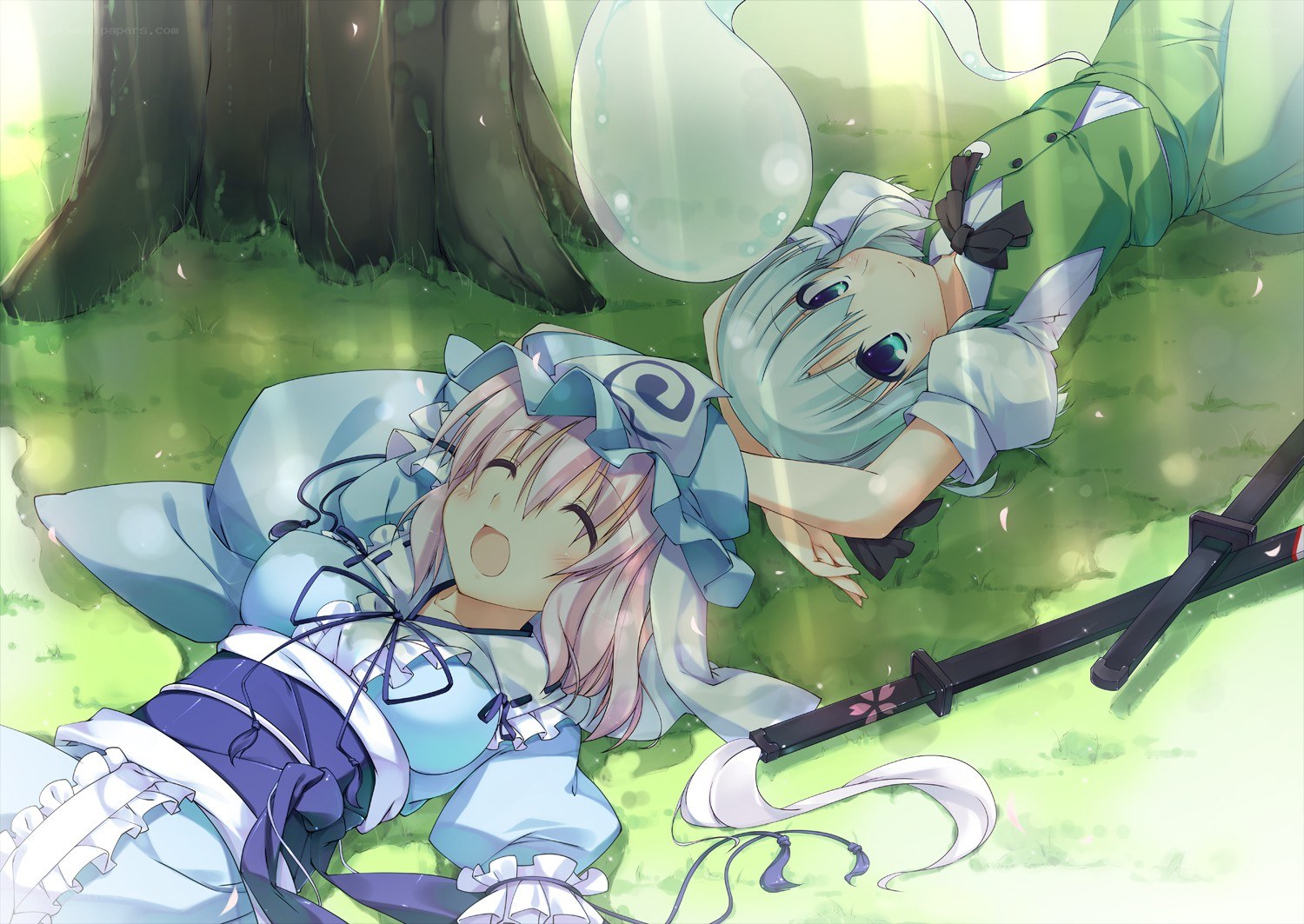 Two girls resting in a forest