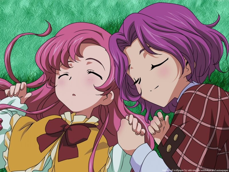 Two girls resting on grass