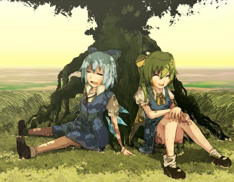 Two girls resting under a tree