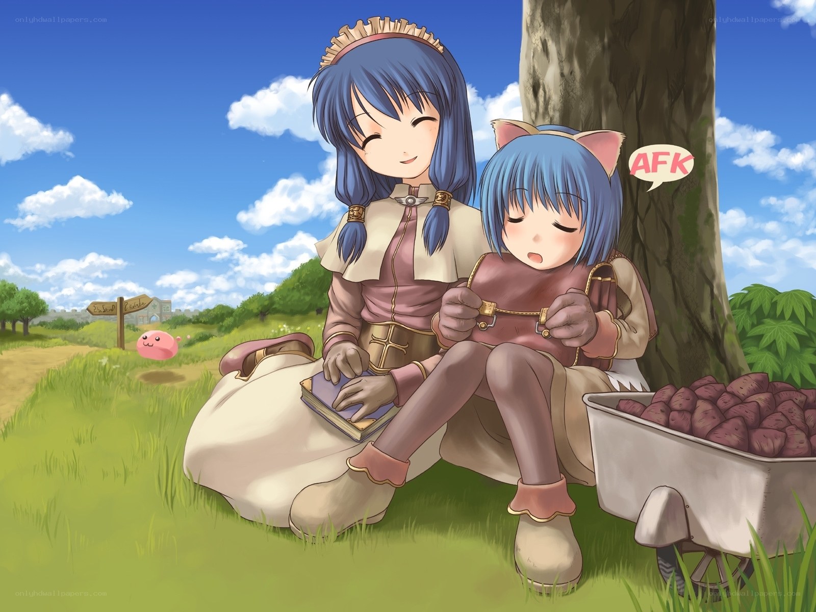 Two girls resting under a tree
