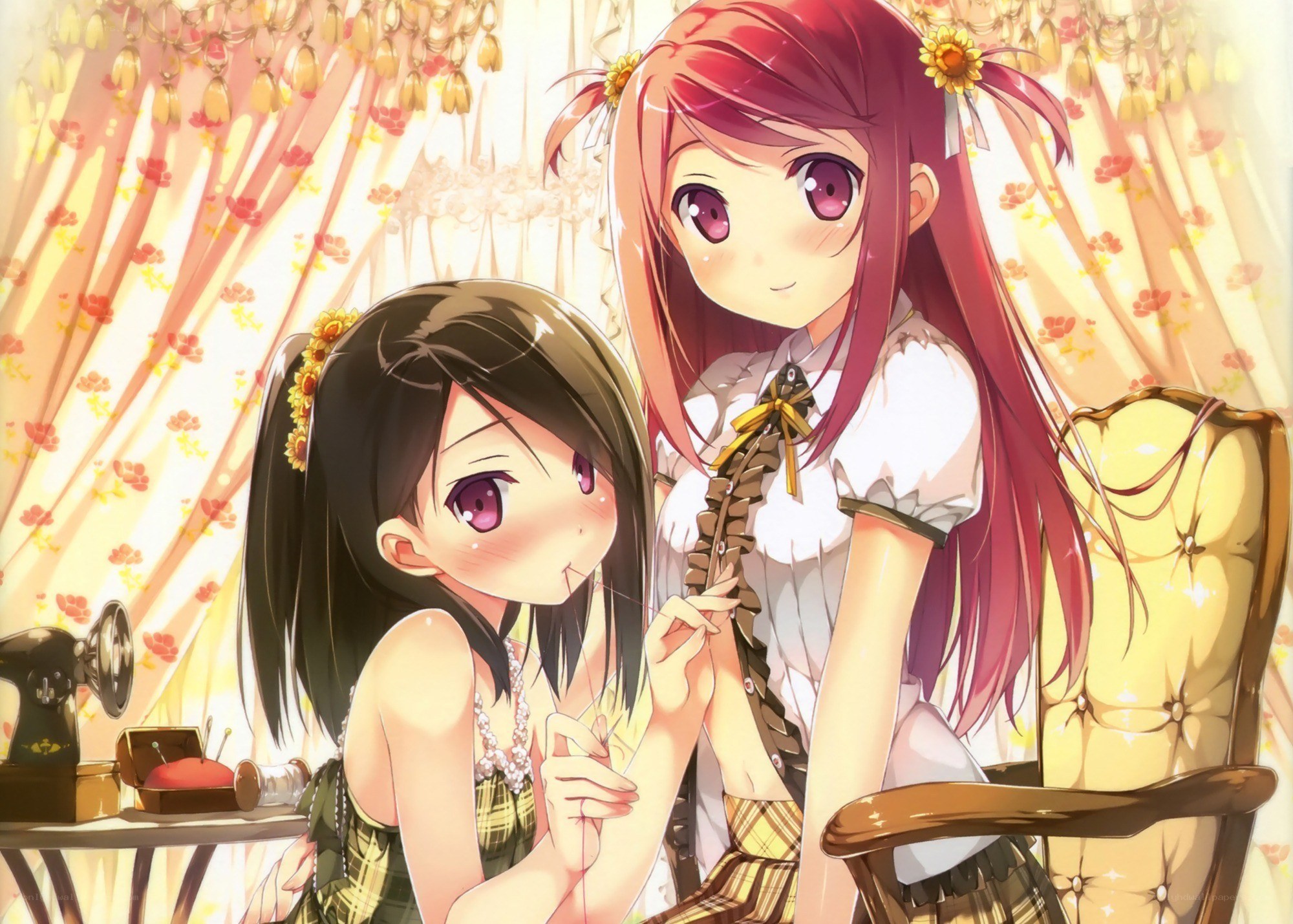 Two girls sewing together