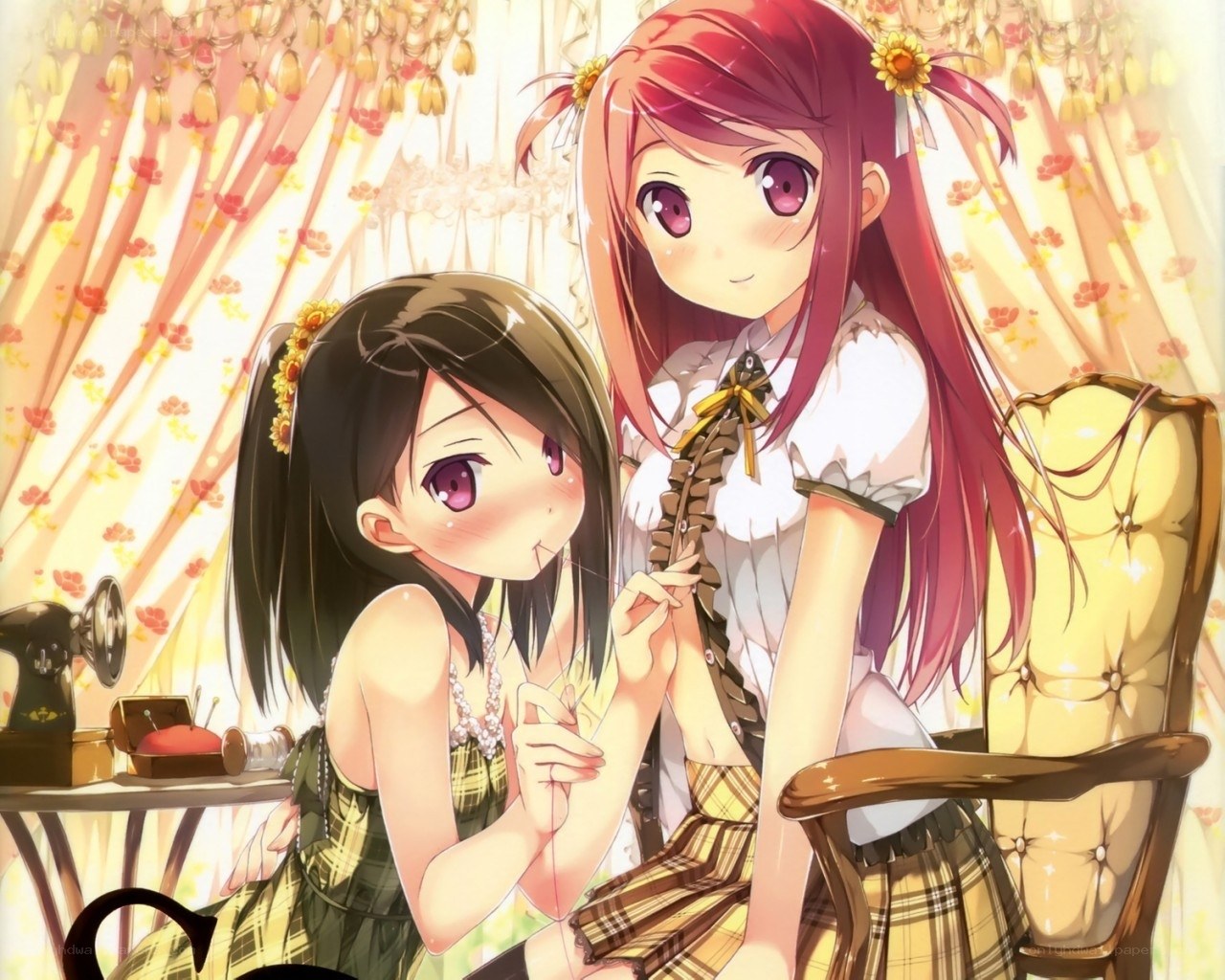 Two girls sewing together