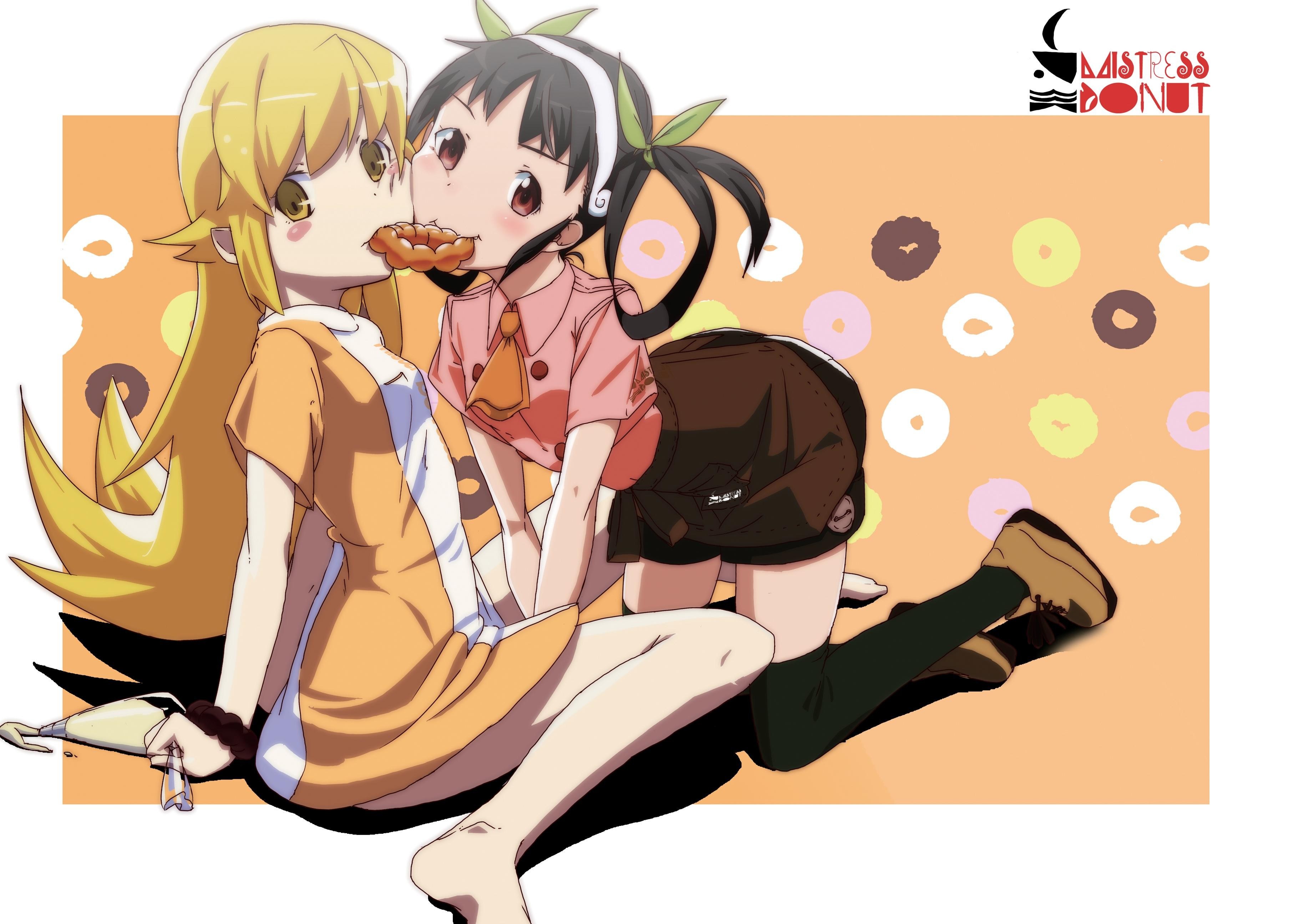 Two girls sharing a donut