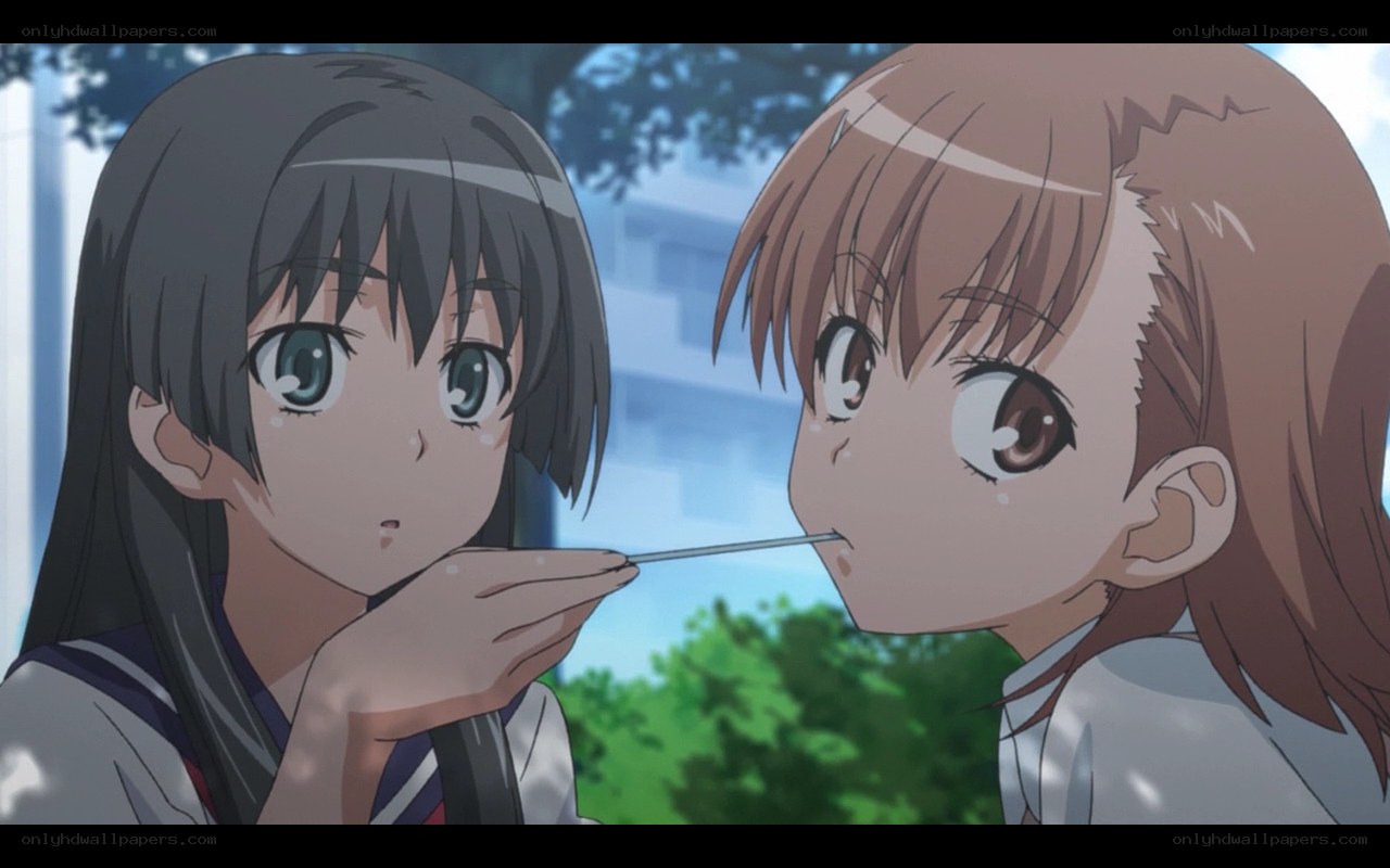 two girls sharing a snack