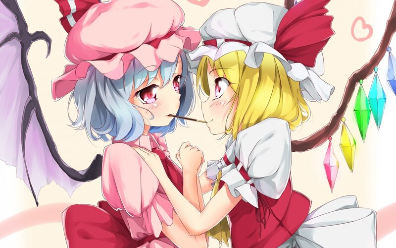two girls sharing a stick