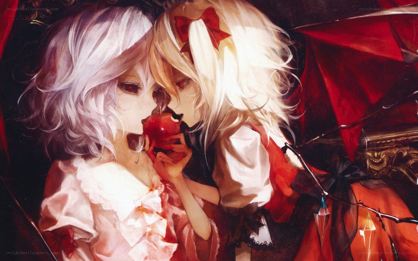 two girls sharing an apple