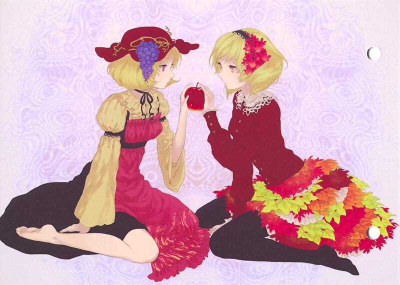 Two girls sharing an apple